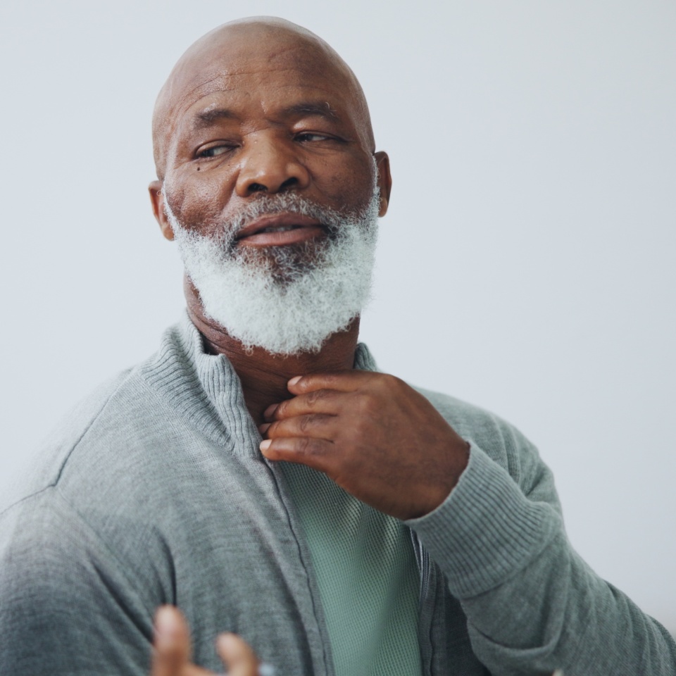 Healthcare, examination and old man consulting doctor for sore throat, pain or thyroid worry and cancer assessment. Hospital, help or senior patient with surgeon for surgery, choice or treatment plan