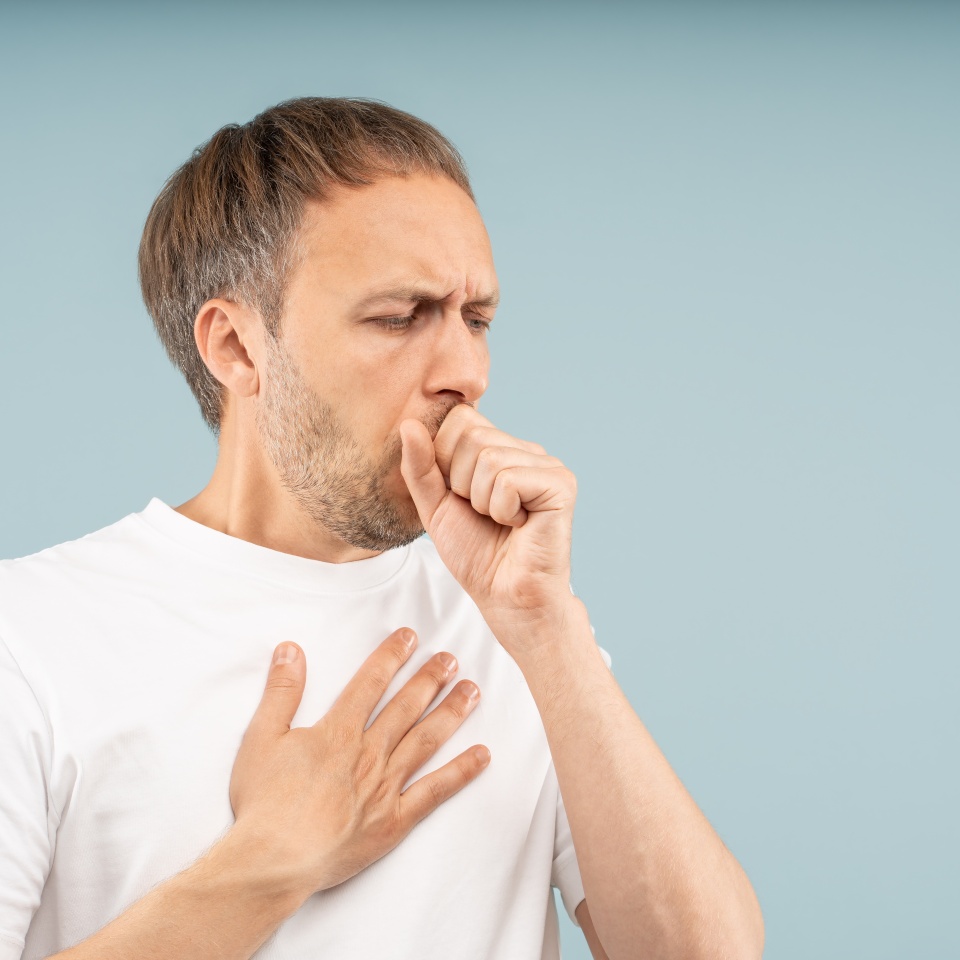 Unwell man struggles with persistent coughing, holding chest by sharp pain. Respiratory health problems, symptoms pneumonia, asthma attacks, allergy-induced cough with discomfort, difficulty breathing