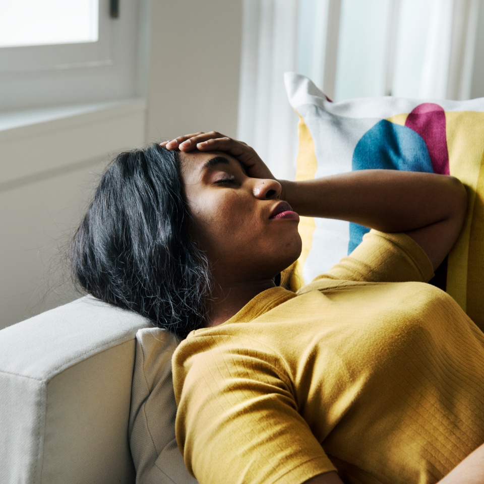 Black woman headache and sleeping